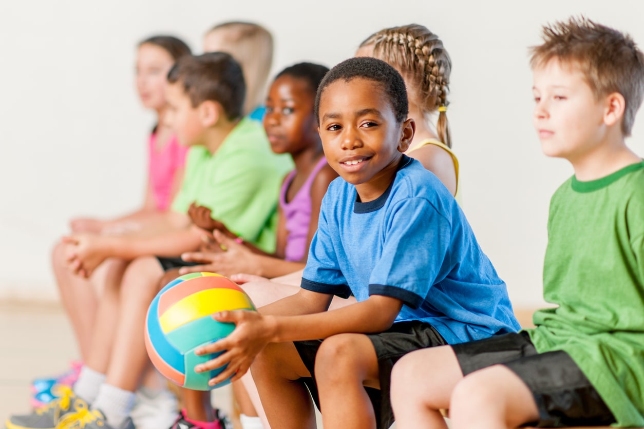 young boy holding a basketball