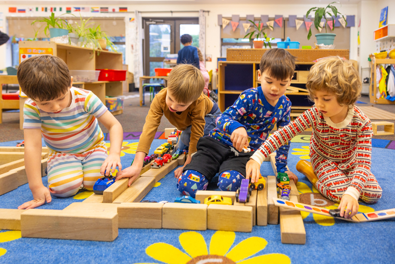 4 boys play with cars
