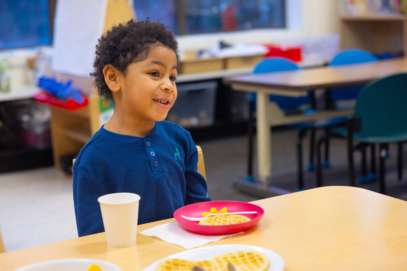 Bipoc Preschooler boy at breakfast