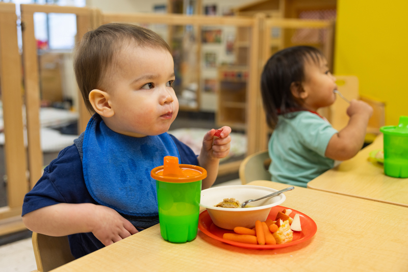Two Toddlers Eat Breakfast